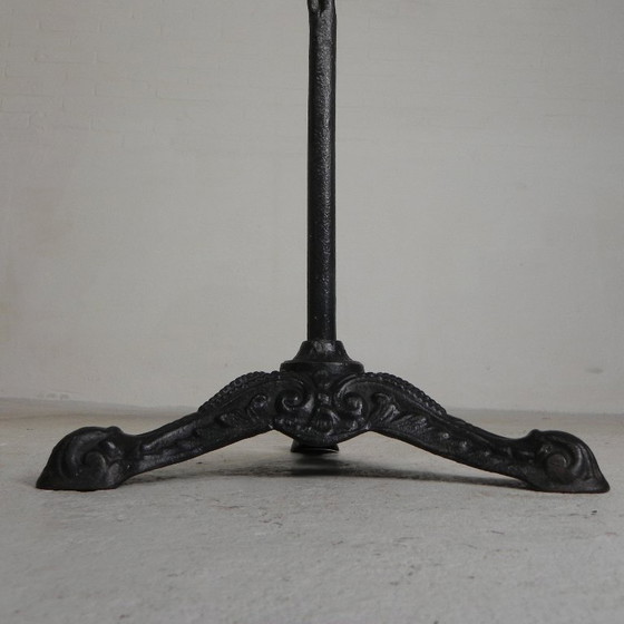 Image 1 of Bistro table with cast iron legs and round steel top, 1930s
