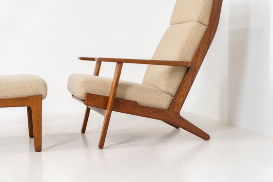 Image 1 of Early GE-290A lounge chair + ottoman in oak by Hans J. Wegner for Getama (Denmark, 1953).