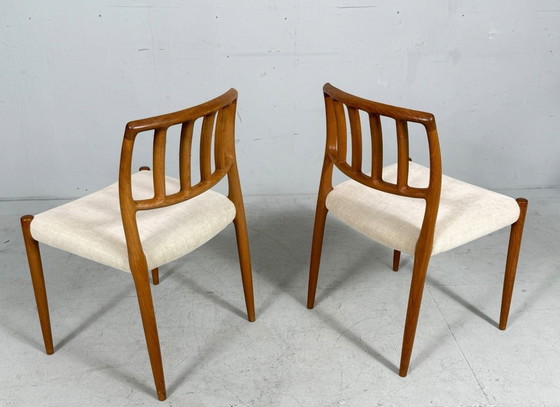 Image 1 of JL Møllers, ensemble de 4 chaises de salle à manger, modèle '83', teck, laine, années 1960, Danemark (4)