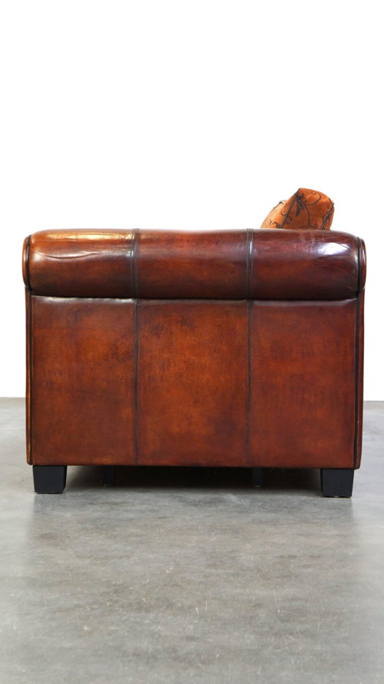 Image 1 of Cómodo sofá de piel de oveja de 2,5 plazas con cojines de tela