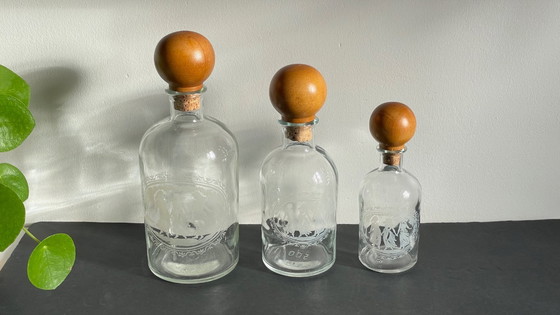 Image 1 of Vintage Engraved Glass and Wood Bottles