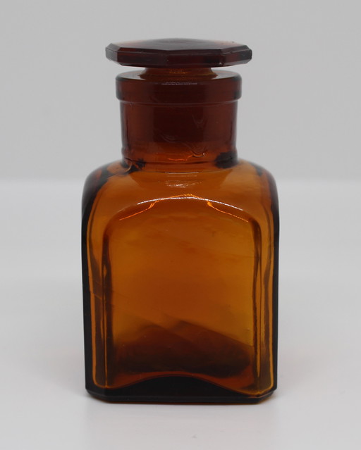 Small amber apothecary bottle