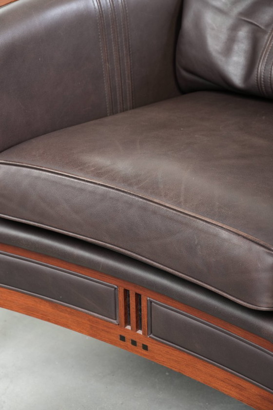 Image 1 of Luxe Schuitema Art Deco design set bestaande uit een fauteuil en hocker uit de Decoforma serie in chocolade bruin rundleer