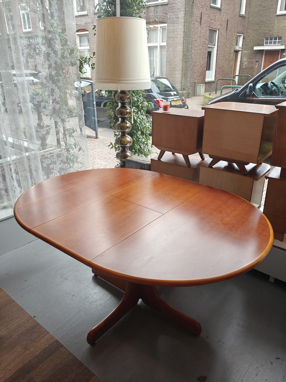 Image 1 of Extendable round to oval dining table