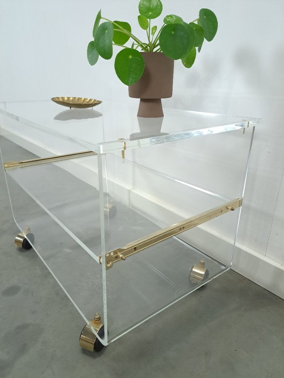 Image 1 of Space age plexiglas trolley met messing