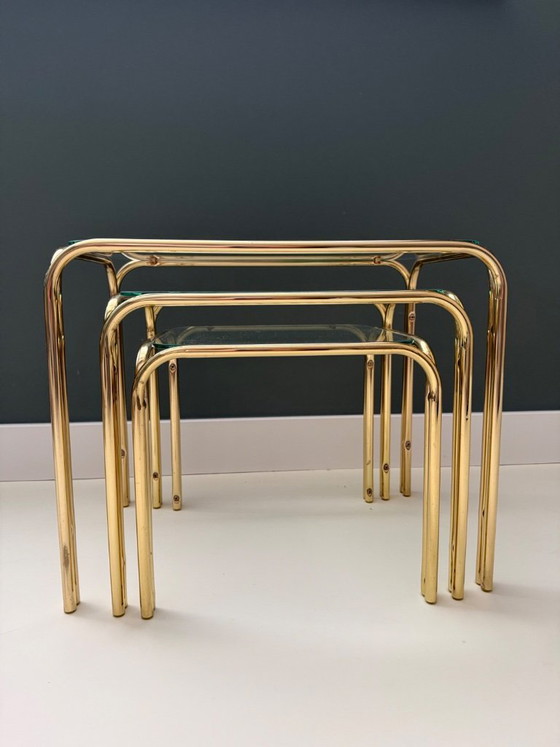 Image 1 of Vintage Mid Century Modern Chrome en glazen bijzettafelset van 3