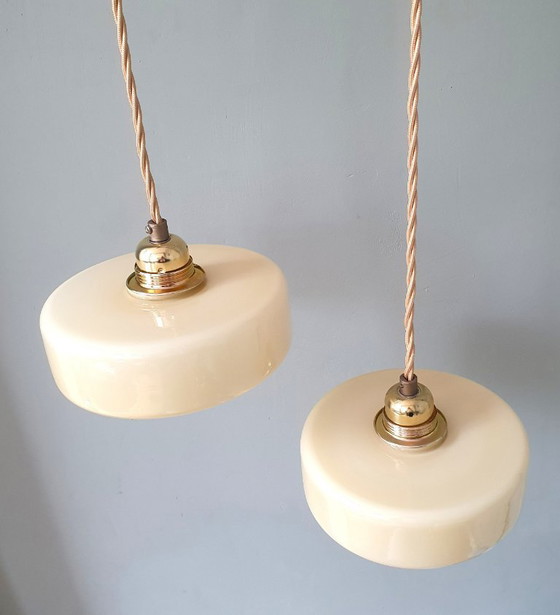 Image 1 of Vintage pendant lamp set (2) of yellow pastel opaline glass. Art Deco design.