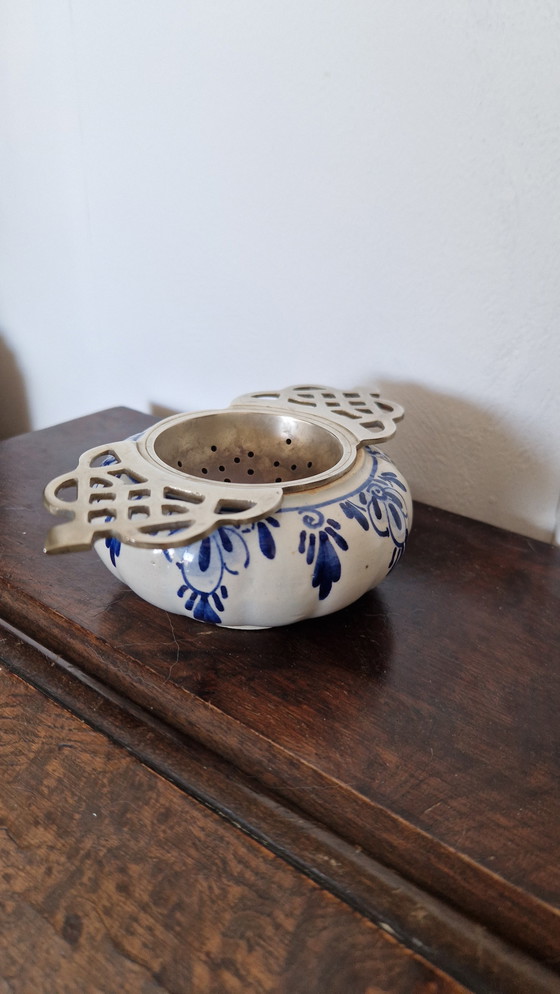 Image 1 of Delft blue tea strainer.