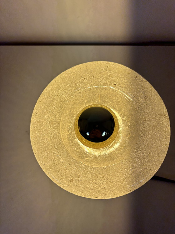 Image 1 of vintage table lamp by Peill & Putzler is made of thick ice glass with brass details