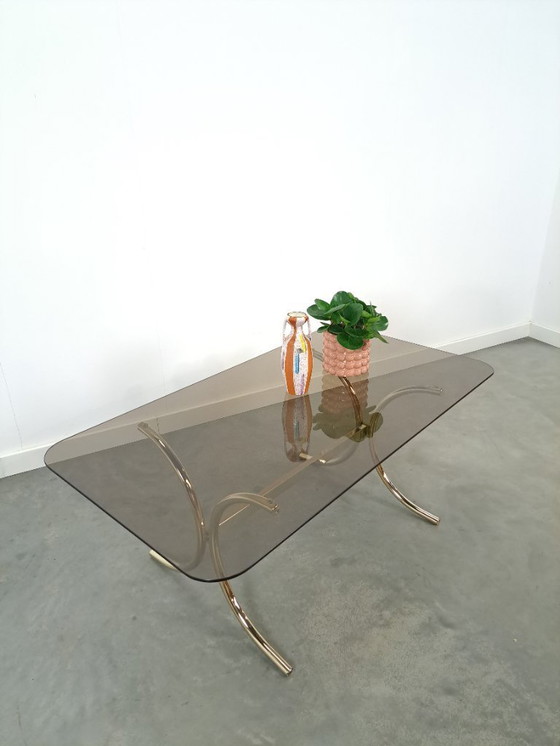 Image 1 of Tavolino in vetro fumé con gambe dorate dalla Svezia