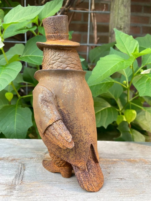 Owl with walking stick and hat made of cast iron