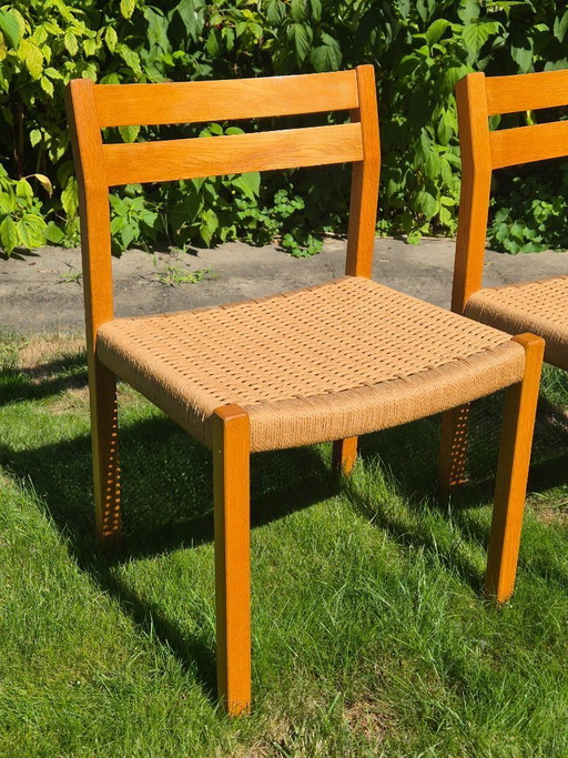 4 Stuks J.L. Møller Model 401 eikenhouten eetkamerstoelen met papercord zitting