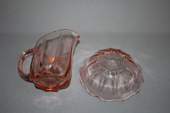 Image 1 of Art Deco Rosalinglas pressed glass pink milk sugar set with floral motif on the bottom