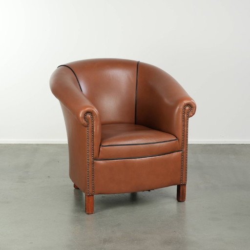 Fauteuil club en cuir de bovin de style anglais avec une apparence luxueuse et un grand confort d'assise