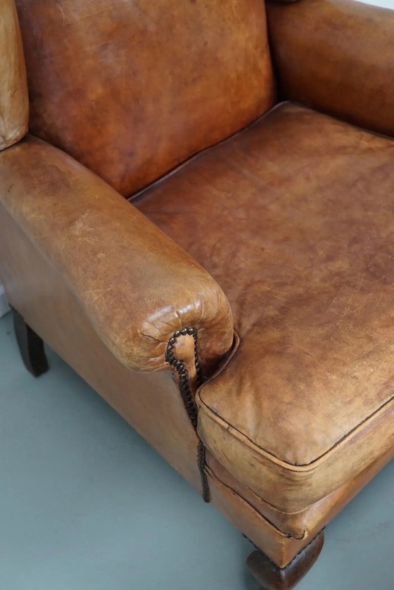 Image 1 of Vintage Nederlandse cognackleurige leren clubfauteuil met voetenbank
