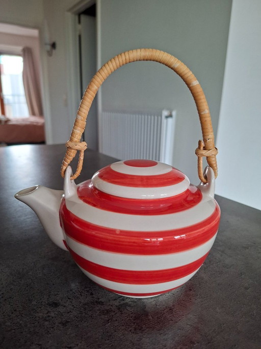 Coral-beige striped teapot with rattan handle