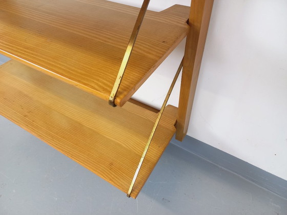 Image 1 of Wall-mounted bookcase with vintage light wood and brass secretary bar, dating from the 1960s