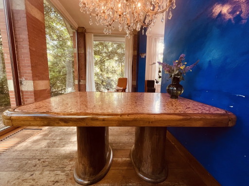 Stylish vintage dining table with marble top.