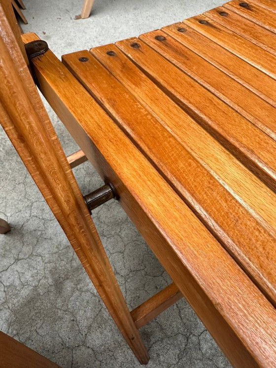 Image 1 of Chaises pliantes vintage en bois (plusieurs disponibles)