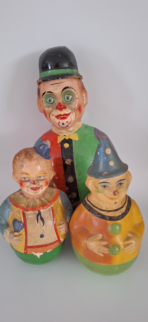 Unique collection of antique Roly Poly Shoe Hut clowns