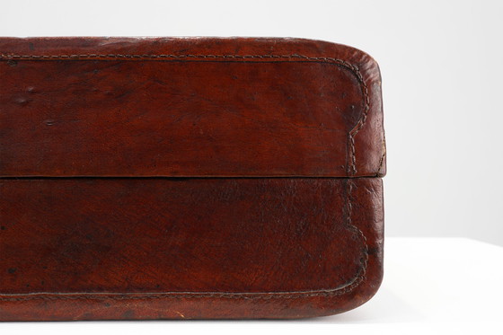 Image 1 of Vintage brown leather suitcase with copper details, China 1900s