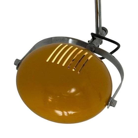 Image 1 of Herda - Lampada da parete spaziale - Paralume giallo, base nera e montante cromato (modello raro)