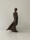 Expressive sculpture figure in the wind - futuristic