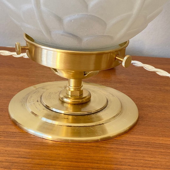 Image 1 of Pair of vintage bedside lamps with antique glass globes and brass bases, circa 1950