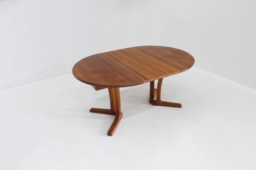 Mesa de comedor redonda extensible vintage Dyrlund danesa de teca maciza.