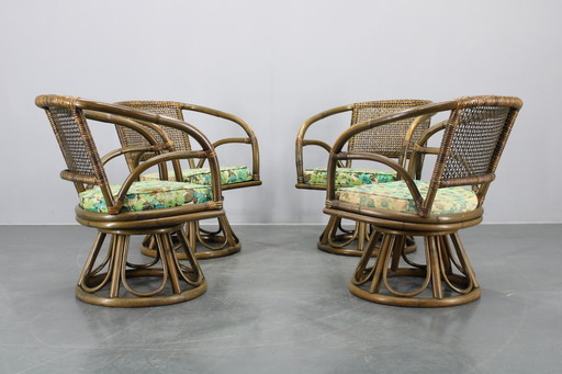 1980 Ensemble de quatre fauteuils en rotin avec coussins en tissu