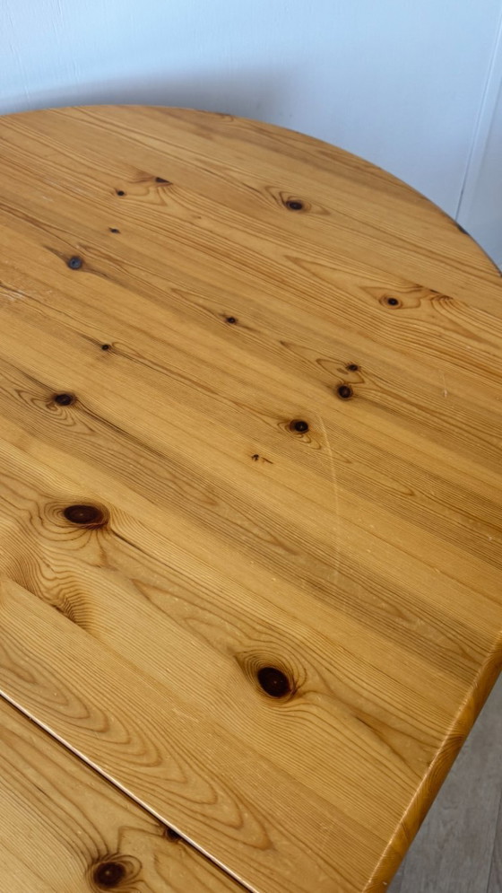 Image 1 of Oval pine extendable table.