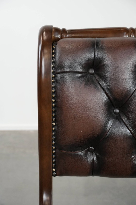 Image 1 of English-style Chesterfield office chair made of cowhide and wood on wheels