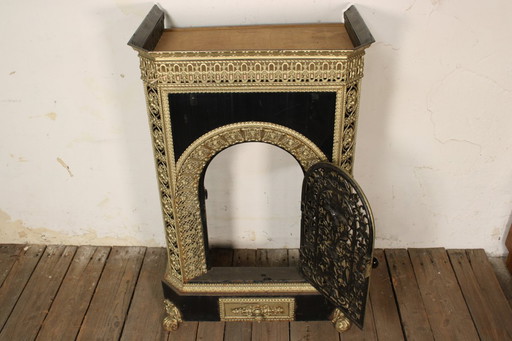 Antique cast iron stove • Vintage iron parlor heater with decoration