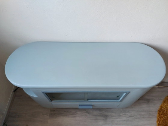 Image 1 of Sideboard with glass sliding doors and rounded shapes