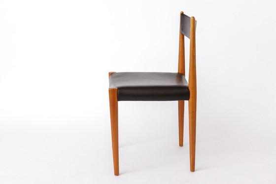 Image 1 of 1 van 6 Vintage Duitse eetkamerstoelen van Lübke, jaren 70, beukenhout en zwart kunstleer (maximaal 6 beschikbaar)