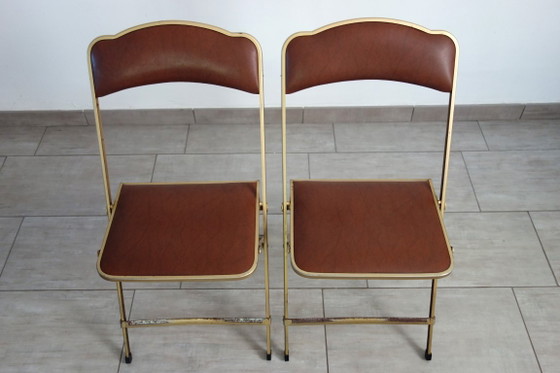 2 Stühle aus vergoldetem Metall und Skai im Opern-Stil der 60er/70er Jahre – Klappstühle (photo 2 of 13)