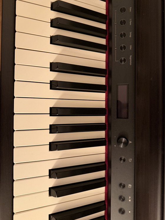 Image 1 of Uitstekende Roland XL705-DR piano - palissanderhout