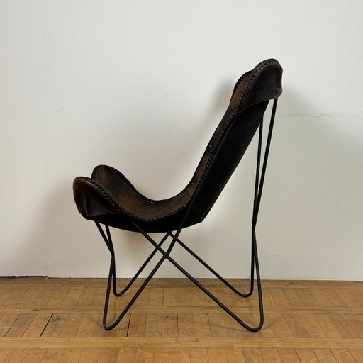 Chaise papillon en cuir vintage 1990