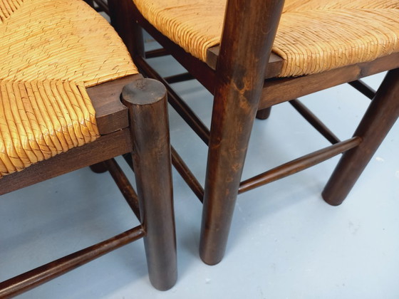 Image 1 of Set van 6 vintage brutalistische stoelen van Georges Robert, gemaakt van hout en stro, uit de jaren 50 en 60.