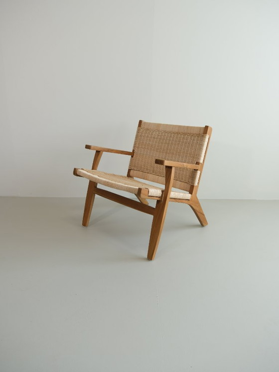 Image 1 of Poltrona lounge Valbona realizzata in teak massello e rattan intrecciato a mano.