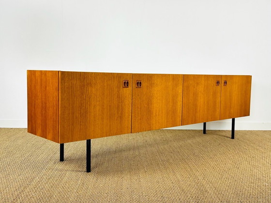 Image 1 of Minimalist Scandinavian sideboard in teak with black metal legs, 1960