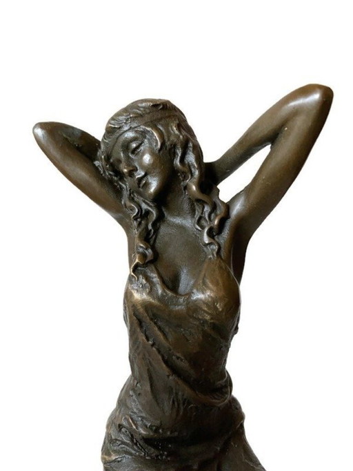 Bronze statue lady on chair