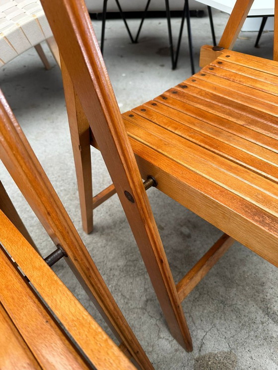 Image 1 of Chaises pliantes vintage en bois (plusieurs disponibles)