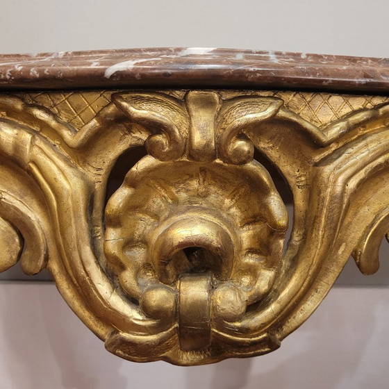 Image 1 of Consolle a muro, in legno intagliato e dorato, stile Luigi XV, XVIII secolo – Francia