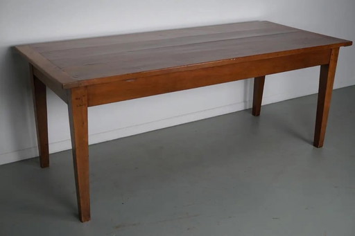 Antique cherry wood French rustic farmhouse dining table from the early 20th century