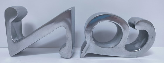 Image 1 of coppia di fermalibri in alluminio pressofuso a forma di "a" e "z"