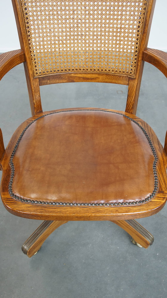 Image 1 of Cognac Colored Leather Office Chair on Wheels with Wood and a Wicker Matted Backrest
