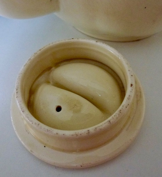 Image 1 of Ceramic Teapot with thermal Chrome casing which keeps the contents hot (or cold).