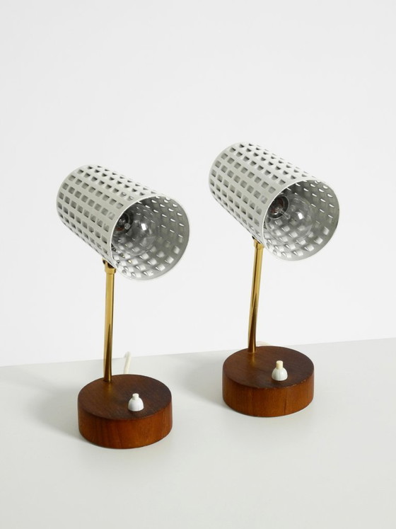 Image 1 of A pair of beautiful mid-century modern bedside lamps with perforated metal shades and teak wood bases