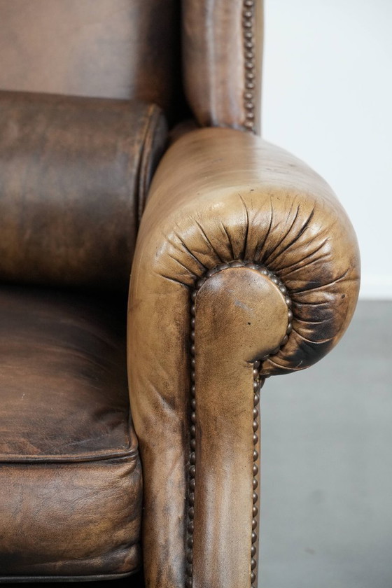 Image 1 of Ohrensessel im englischen Stil aus Kuhfell